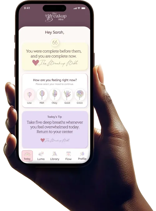 The Breakup Bible app preview held in hand
